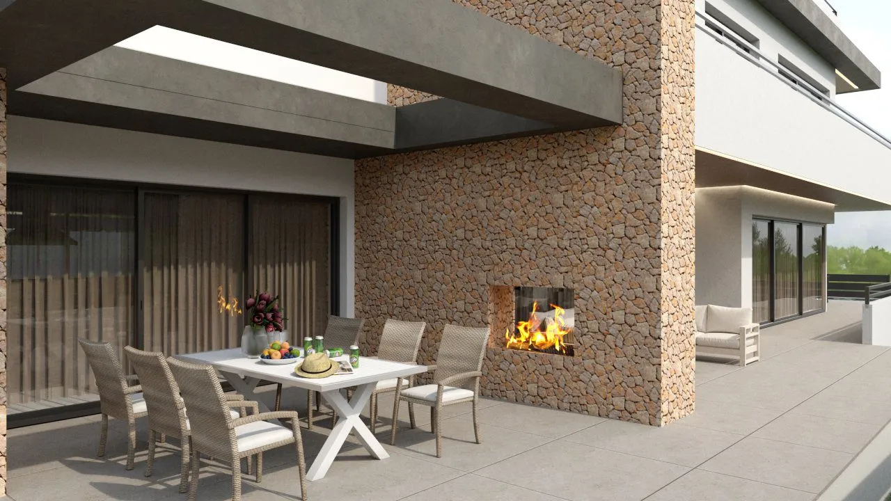 Porche comedor con chimenea y muro de piedra, vivienda Sam2 en Bonanova
